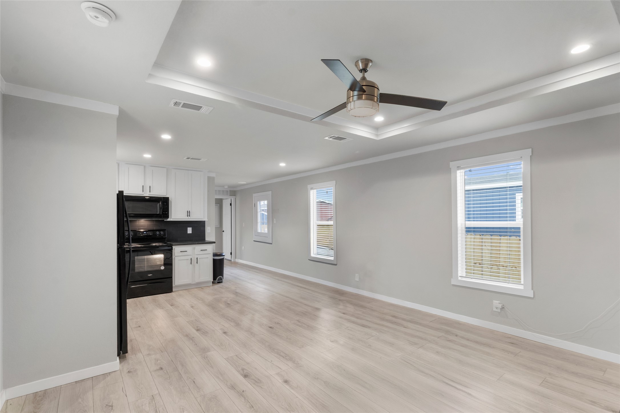119 Mooney Road Pearland, TX 77581 - Photo 2 of 25 a view of kitchen with window and wooden floor