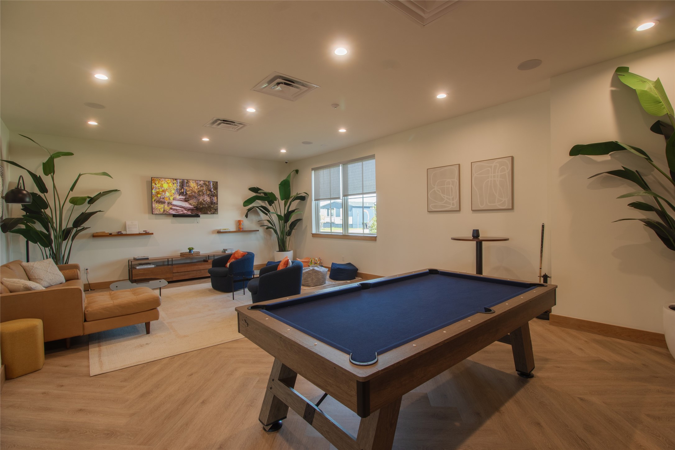 119 Mooney Road Pearland, TX 77581 - Photo 22 of 25 a living room with furniture a table and a flat screen tv