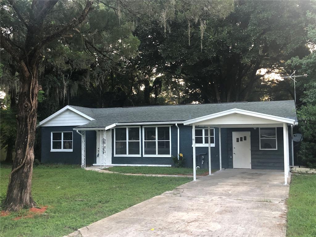 135 Naranja Road DeBary, FL 32713 - Photo 1 of 1 a front view of a house with a garden