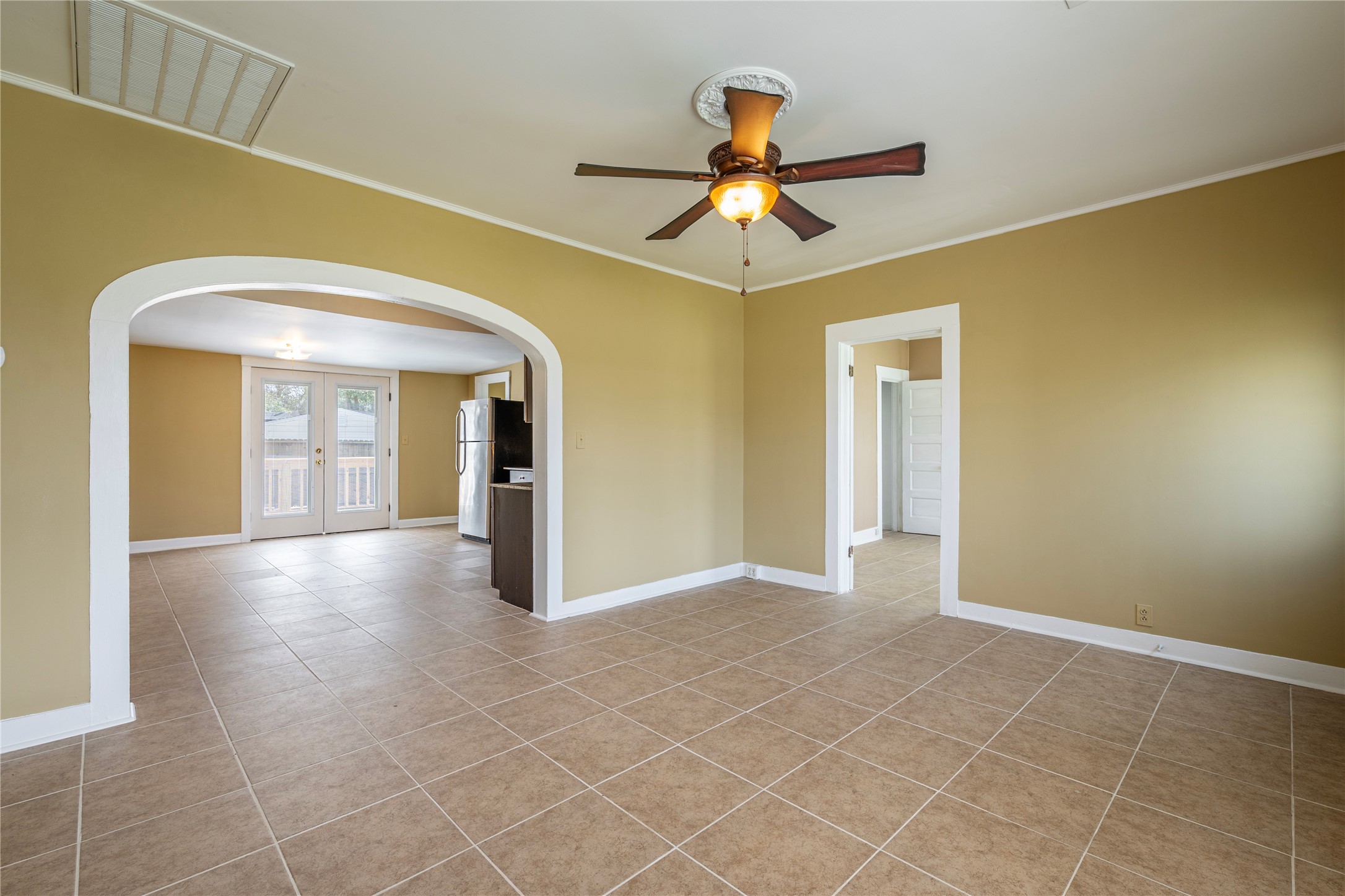 805 Chestnut Street La Marque, TX 77568 - Photo 6 of 26 a view of a big room with a chandelier fan and windows