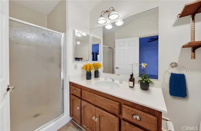 a bathroom with a sink a vanity and a mirror