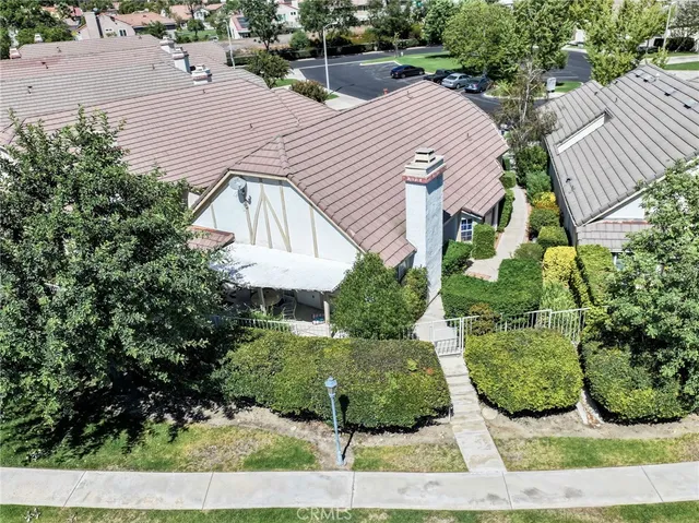 an aerial view of a house with a garden