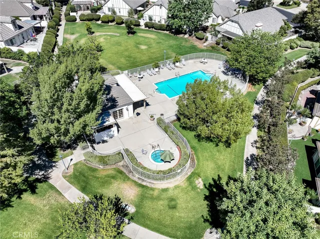 an aerial view of a house with outdoor space