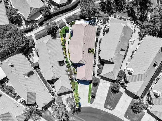 an aerial view of multiple houses with outdoor space