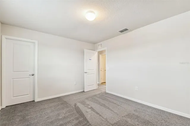 an empty room with a empty space and window