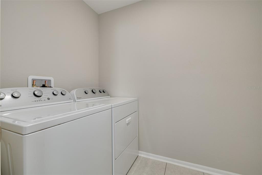 7242 Landmark Drive Spring Hill, FL 34606 - Photo 38 of 45 a utility room with dryer and washer