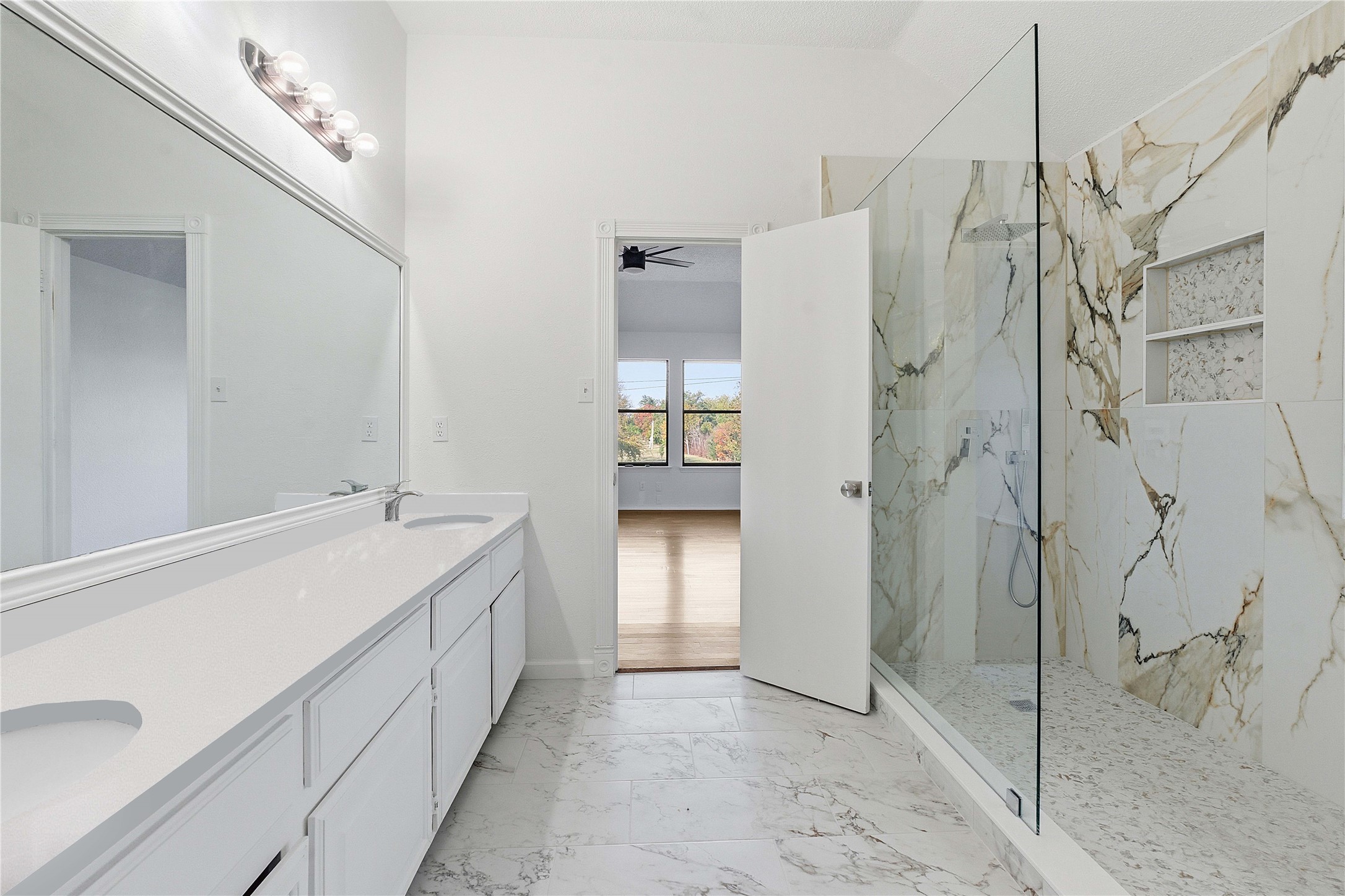 1106 Split Oak Cove Pflugerville, TX 78660 - Photo 13 of 25 a spacious bathroom with a double vanity sink and a shower