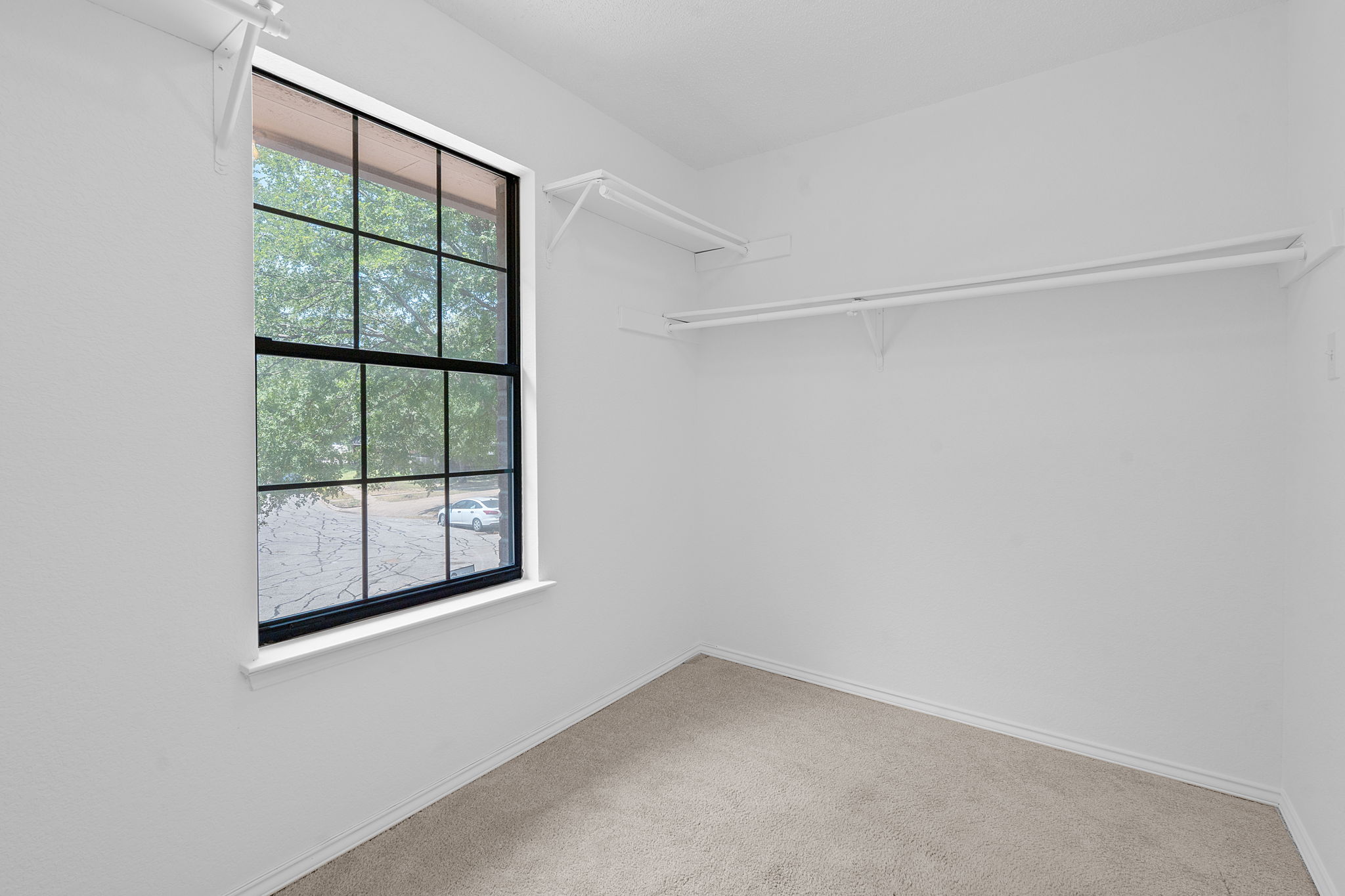 1106 Split Oak Cove Pflugerville, TX 78660 - Photo 16 of 25 a view of an empty room with a window