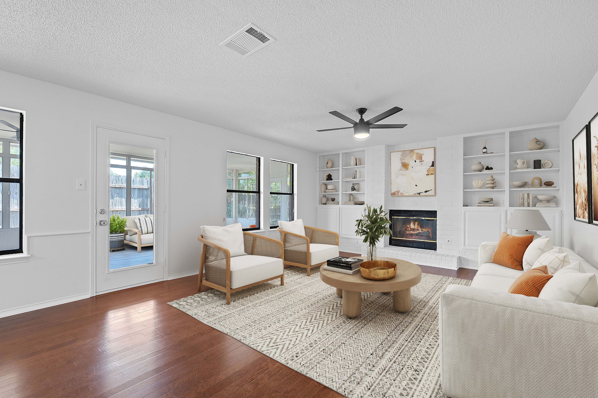 1106 Split Oak Cove Pflugerville, TX 78660 - Photo 2 of 27 a living room with furniture a fireplace and a table