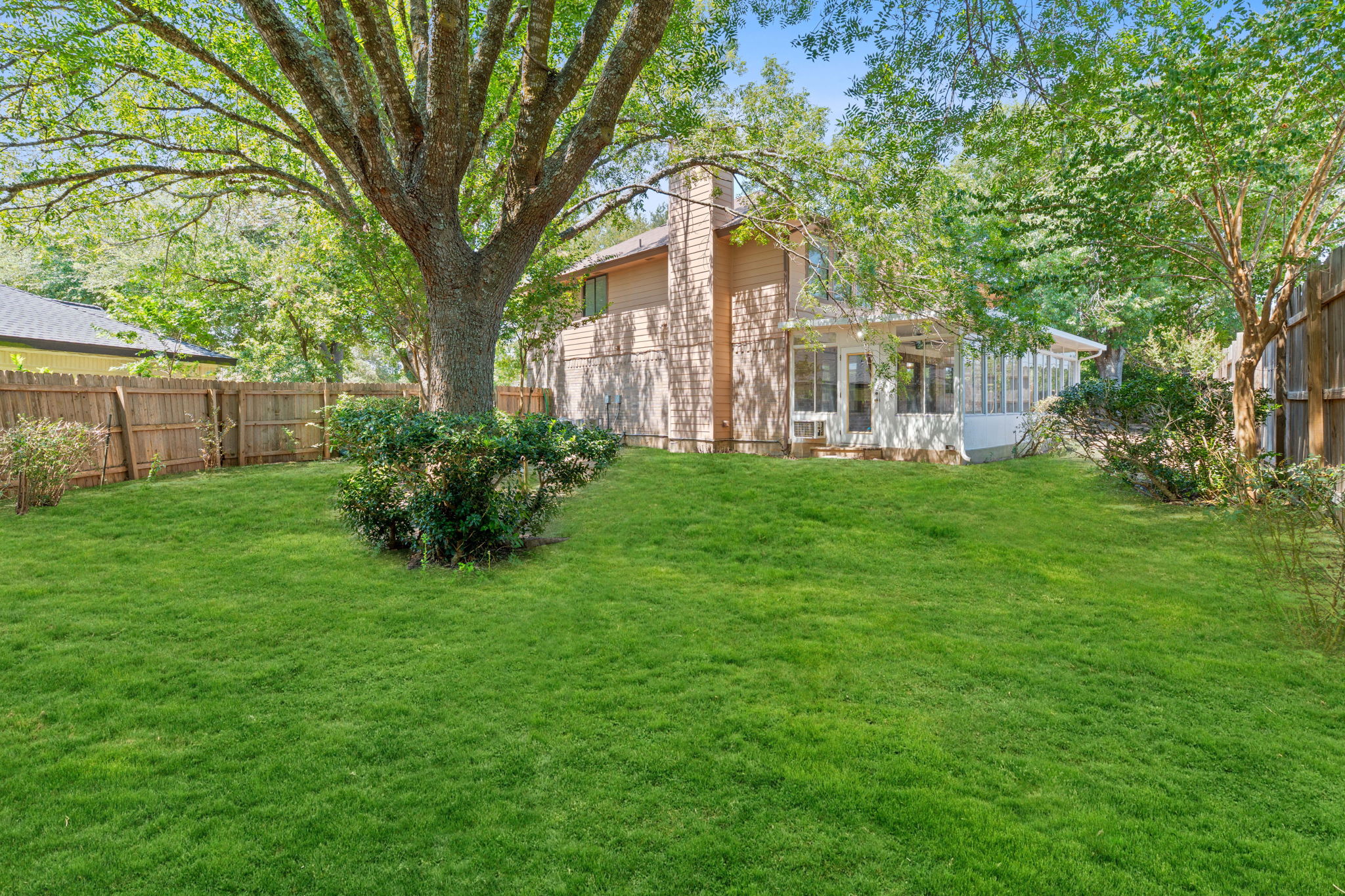 1106 Split Oak Cove Pflugerville, TX 78660 - Photo 22 of 25 Fenced backyard featuring a sunroom