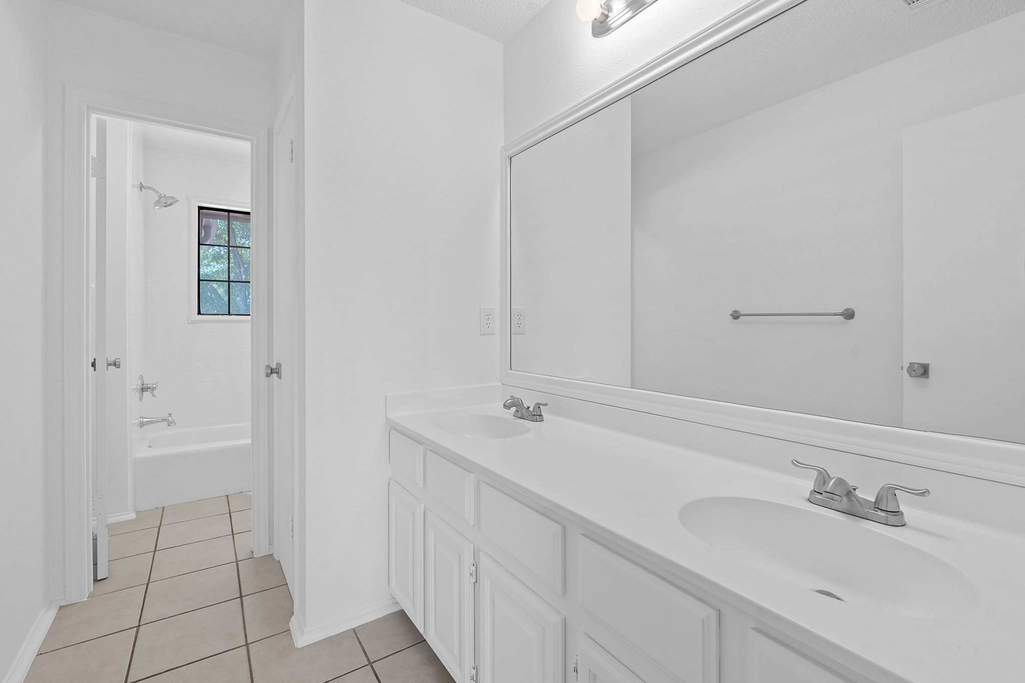 1106 Split Oak Cove Pflugerville, TX 78660 - Photo 24 of 27 a bathroom with a sink and a mirror