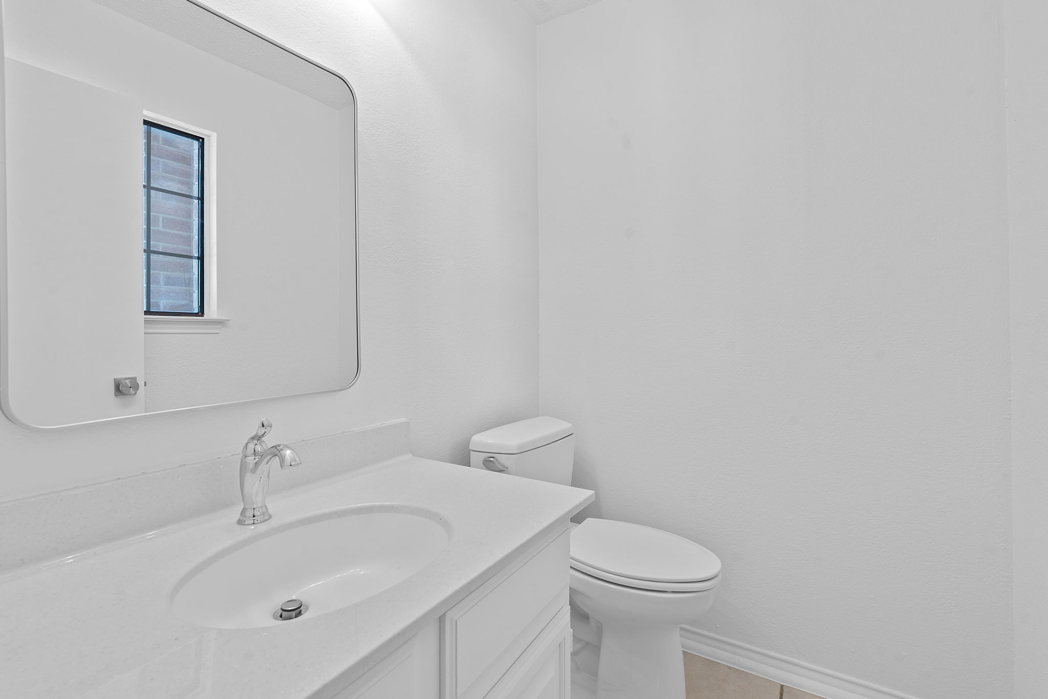 1106 Split Oak Cove Pflugerville, TX 78660 - Photo 26 of 27 a bathroom with a sink mirror and toilet