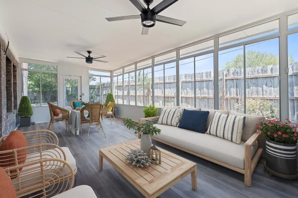 a living room with furniture and a large window