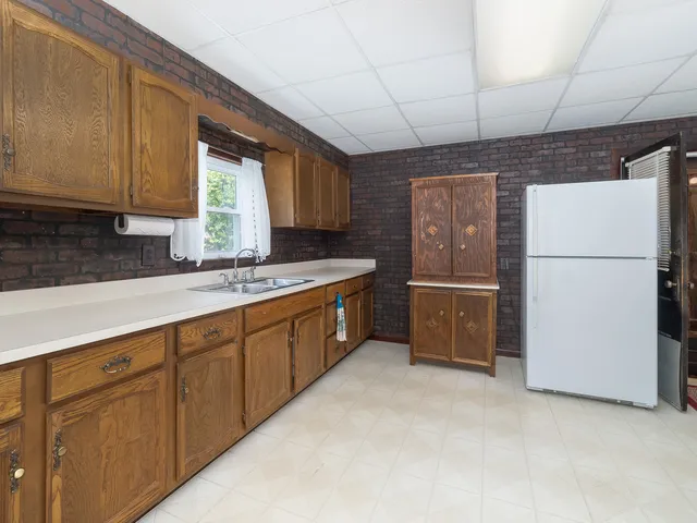a kitchen with sink cabinets and window