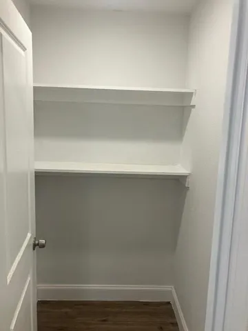 a view of small space with racks on the wall