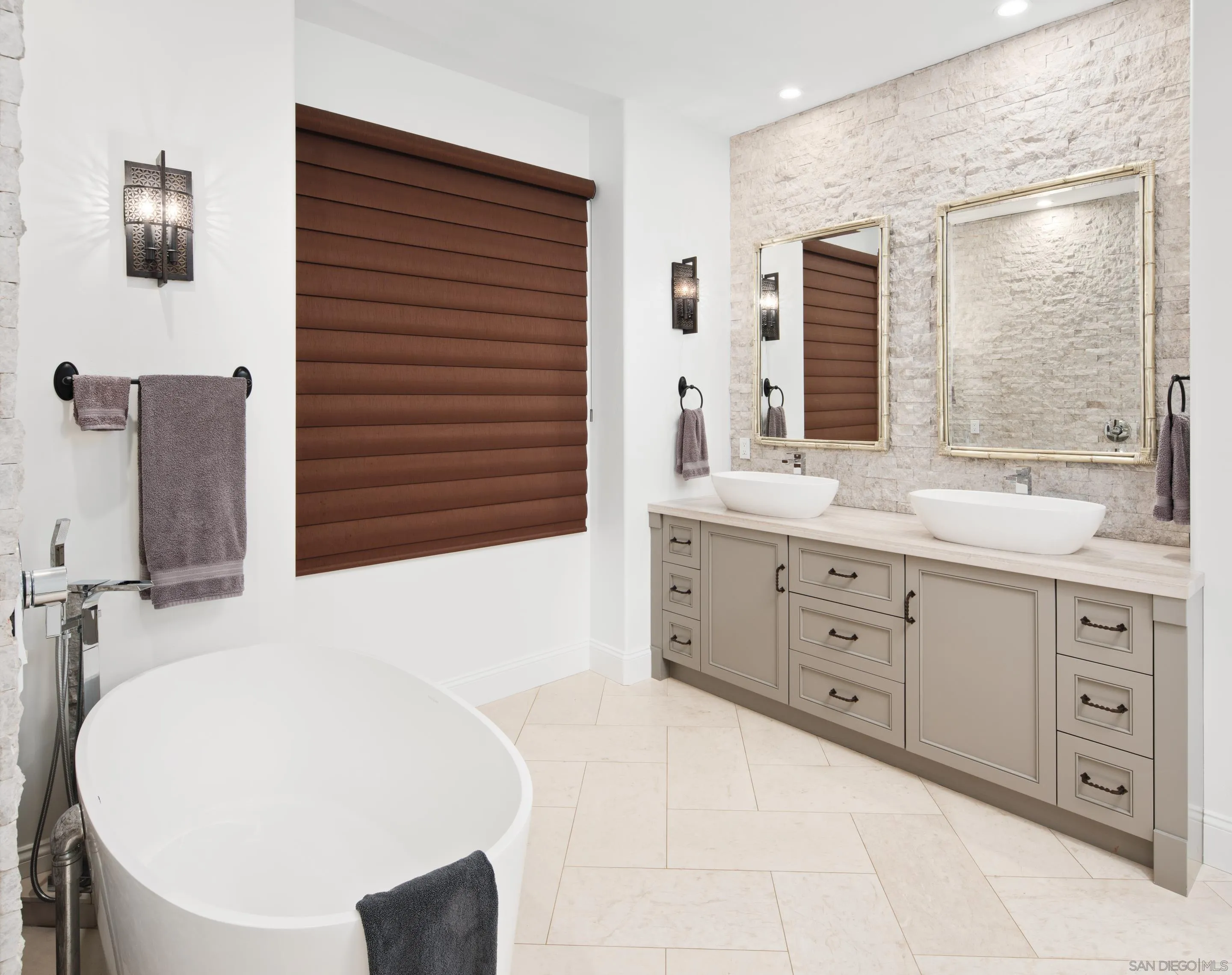 3537 Silvergate Place San Diego, CA 92106 - Photo 18 of 43 a bathroom with a double vanity sink a mirror and a shower