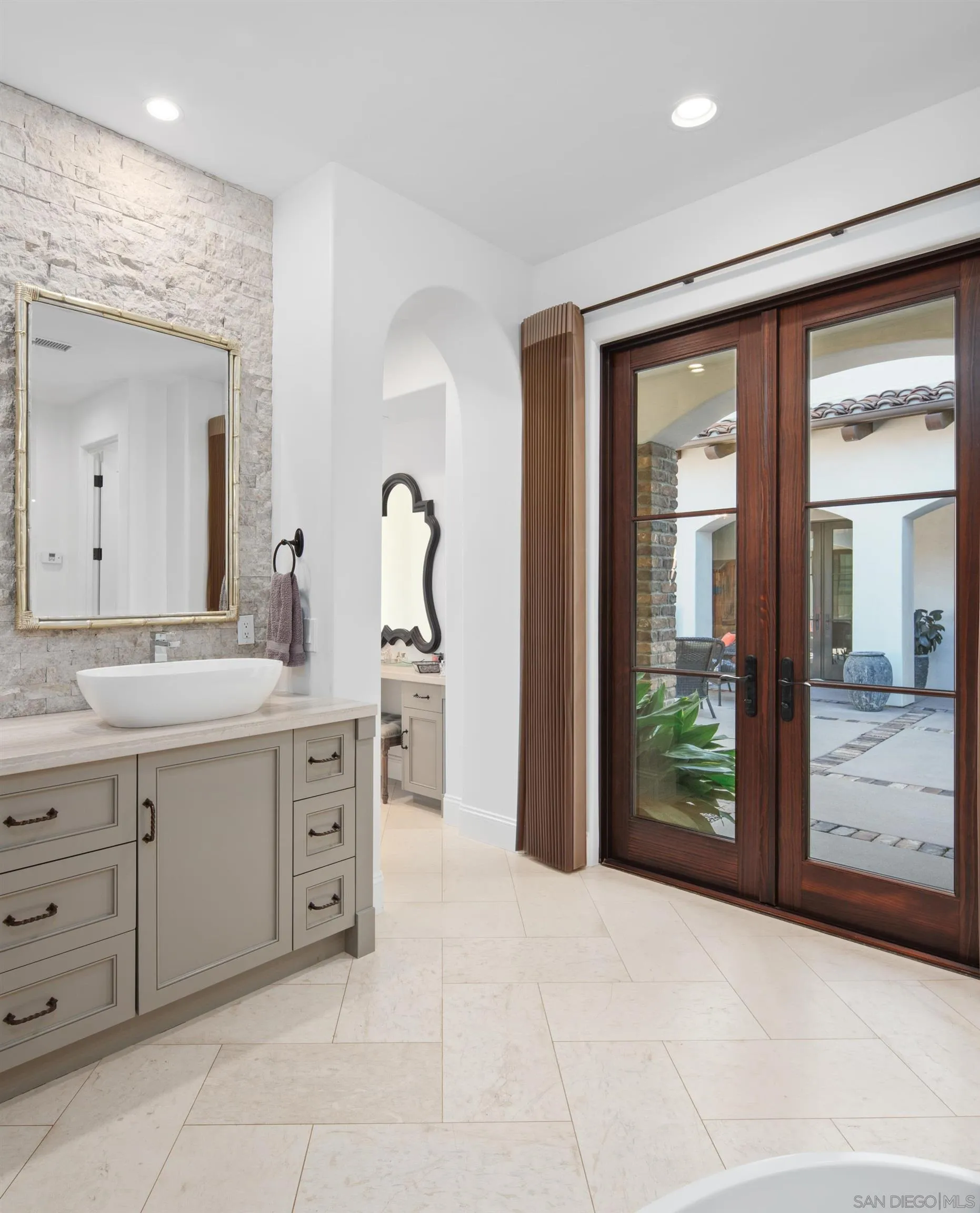 3537 Silvergate Place San Diego, CA 92106 - Photo 20 of 43 a spacious bathroom with a shower sink and mirror