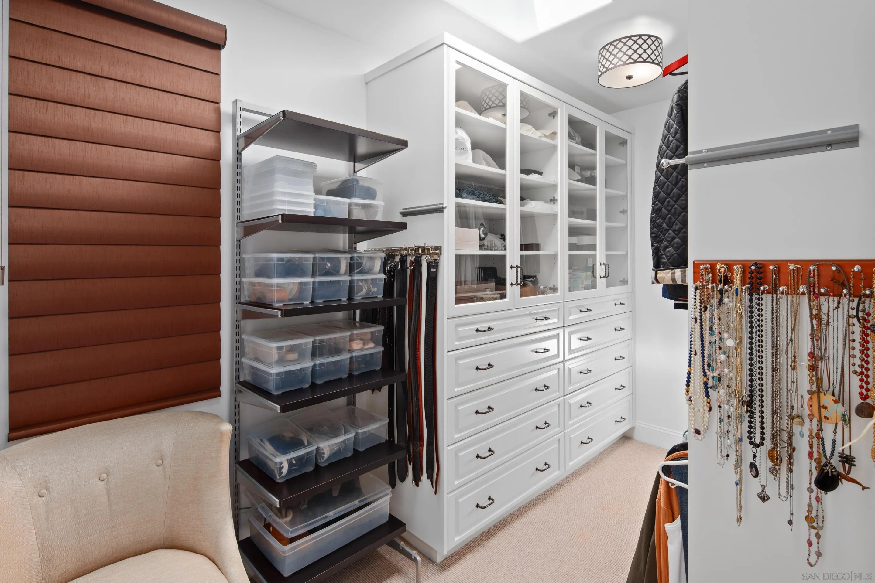 3537 Silvergate Place San Diego, CA 92106 - Photo 21 of 43 a view of walk in closet with clothes and shoes
