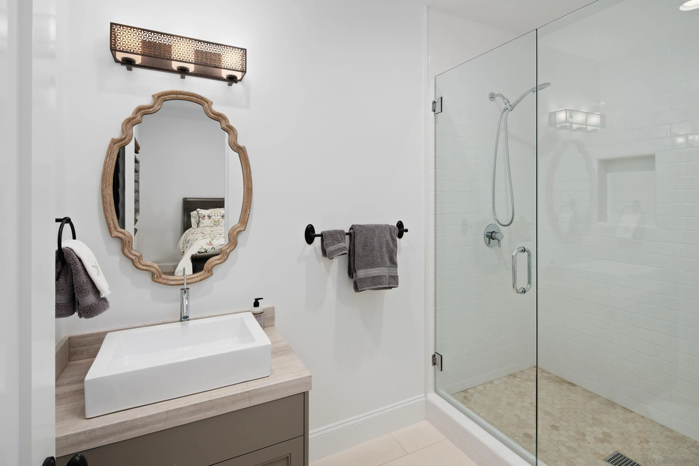 3537 Silvergate Place San Diego, CA 92106 - Photo 28 of 43 a bathroom with a sink and mirror