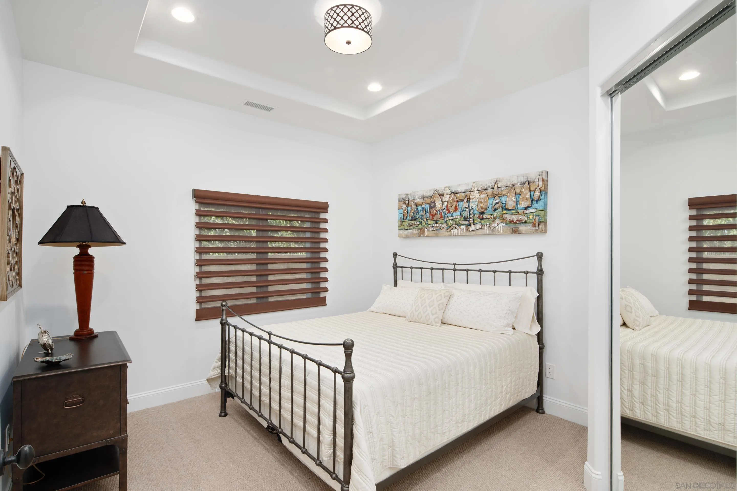 3537 Silvergate Place San Diego, CA 92106 - Photo 29 of 43 a bedroom with a bed and a lamp