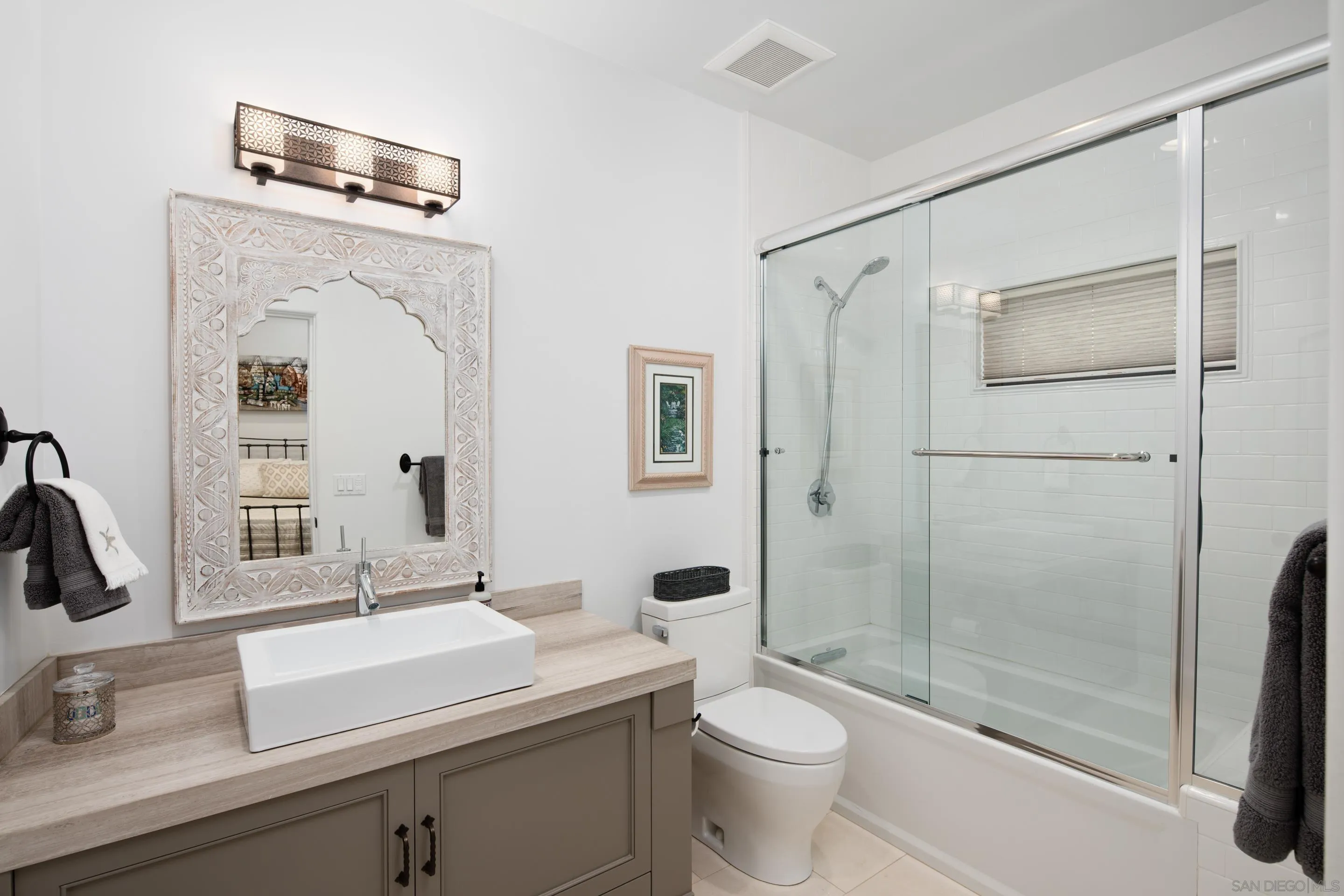 3537 Silvergate Place San Diego, CA 92106 - Photo 30 of 43 a bathroom with a sink a toilet and shower