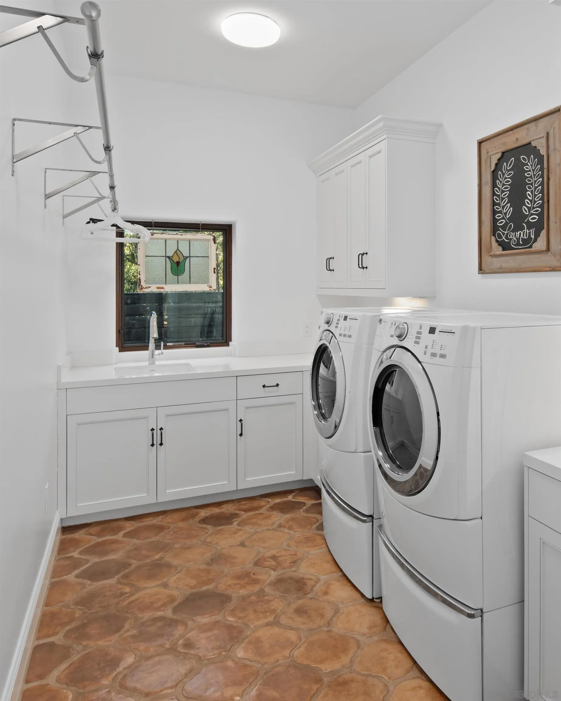 3537 Silvergate Place San Diego, CA 92106 - Photo 32 of 43 a view of a storage & utility room with washer and dryer