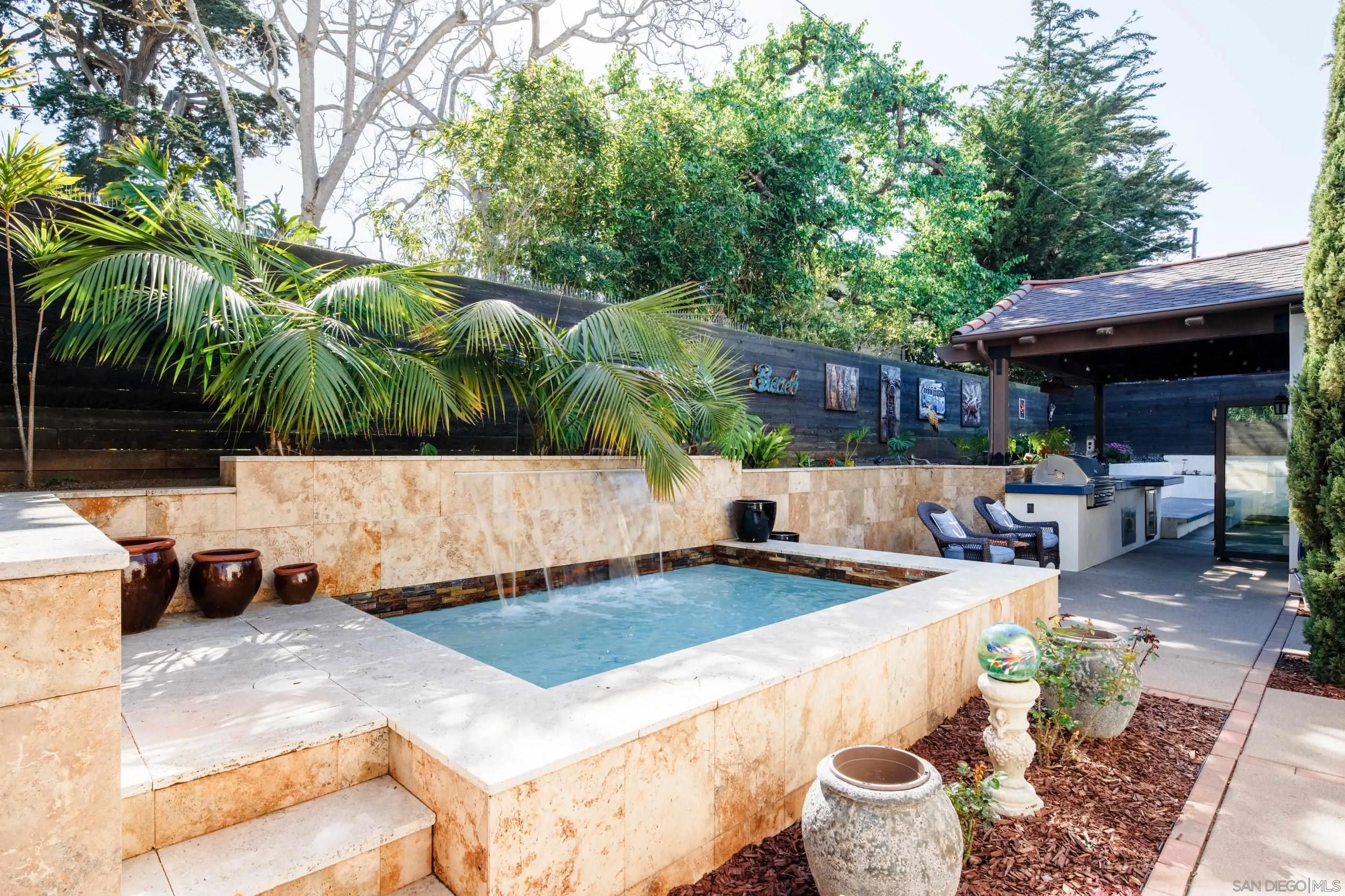 3537 Silvergate Place San Diego, CA 92106 - Photo 34 of 43 a outdoor space with lots of table and chairs under an umbrella