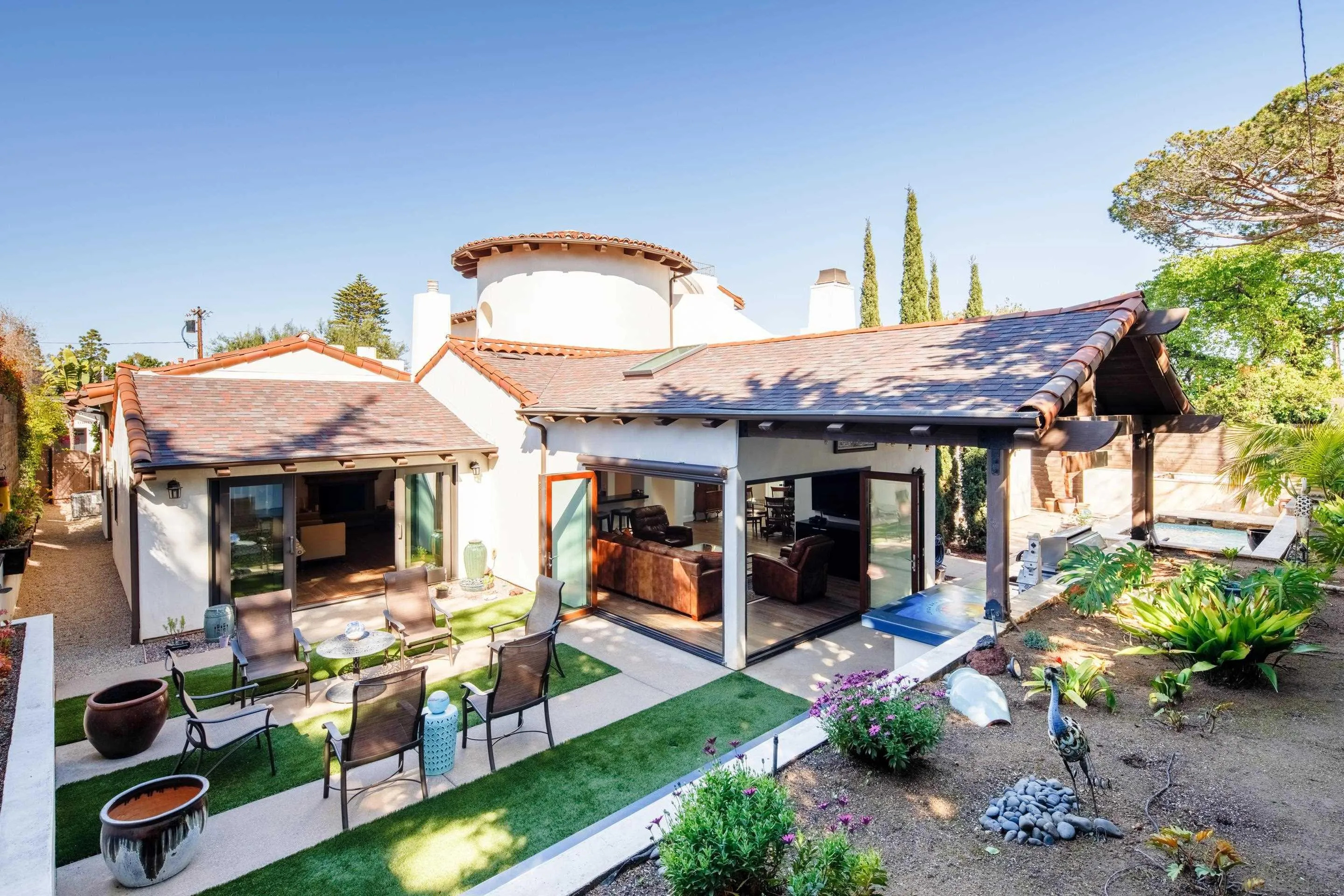 3537 Silvergate Place San Diego, CA 92106 - Photo 35 of 43 a view of a patio with table and chairs potted plants and large tree