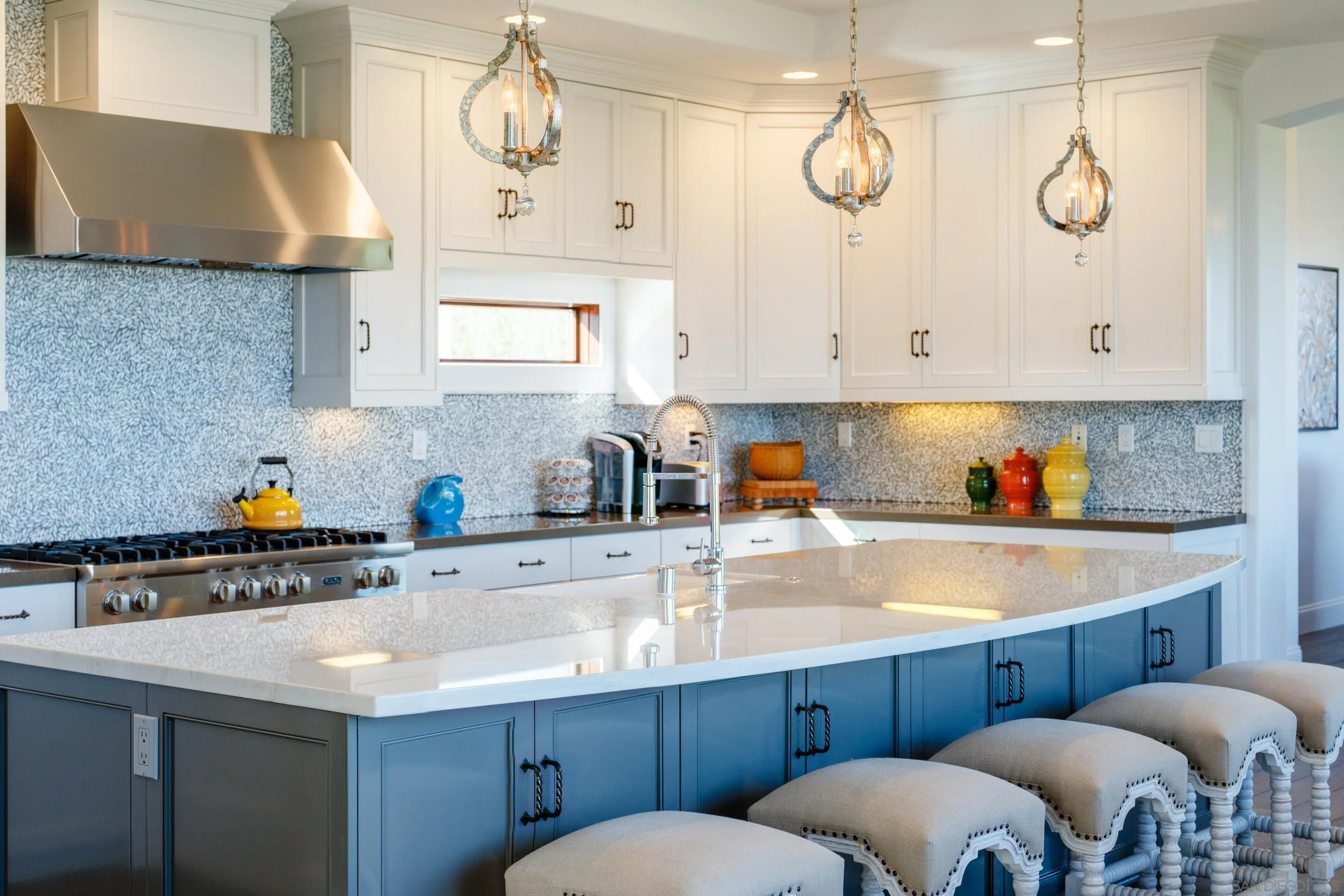 3537 Silvergate Place San Diego, CA 92106 - Photo 8 of 43 a kitchen with cabinets a window and stainless steel appliances