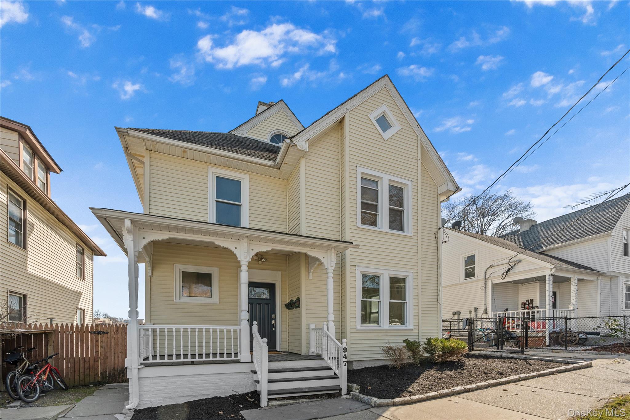 947 Diven Street Peekskill, NY 10566 - Photo 2 of 28 a front view of a house with a yard