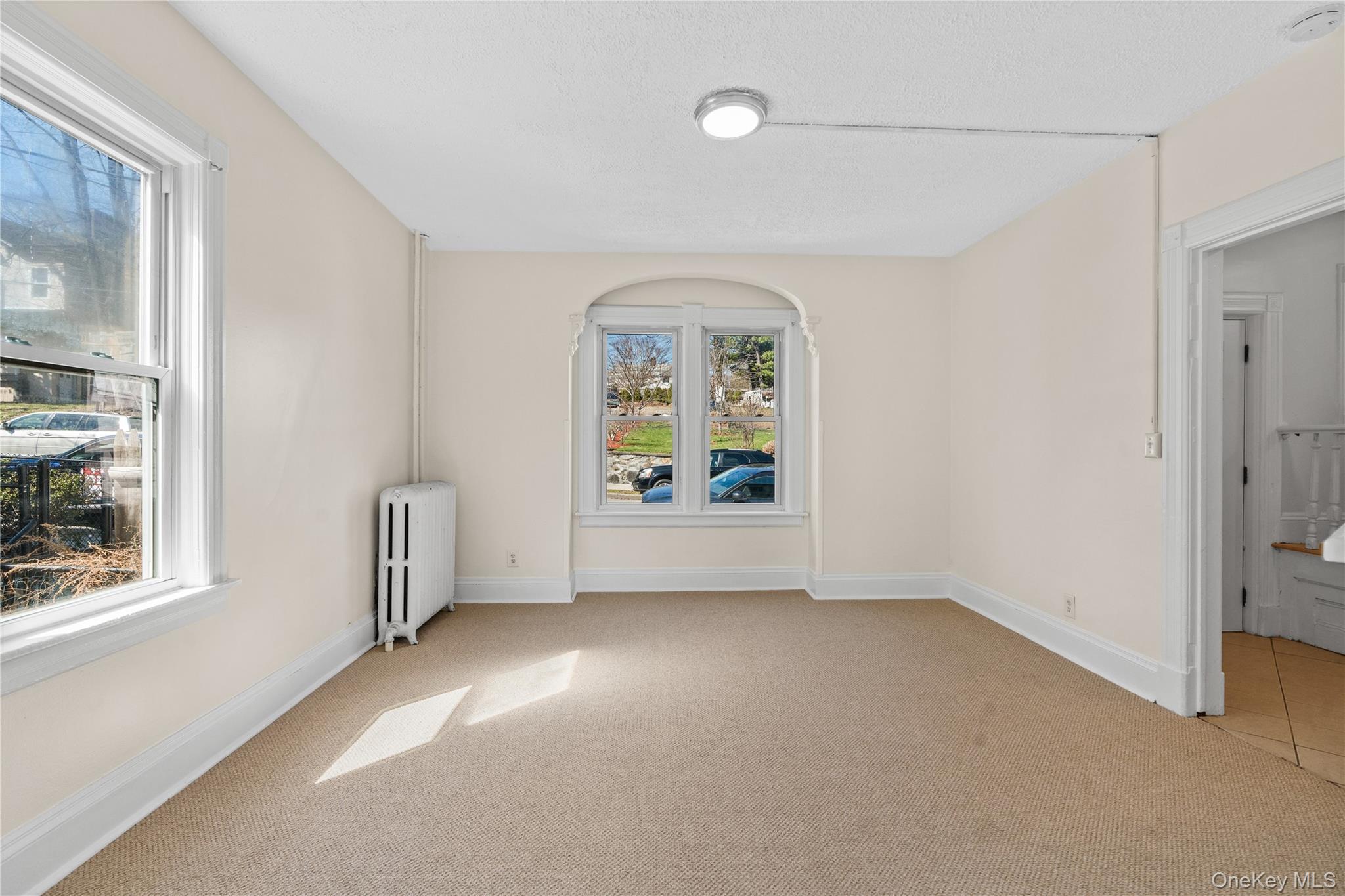 947 Diven Street Peekskill, NY 10566 - Photo 4 of 28 an empty room with windows