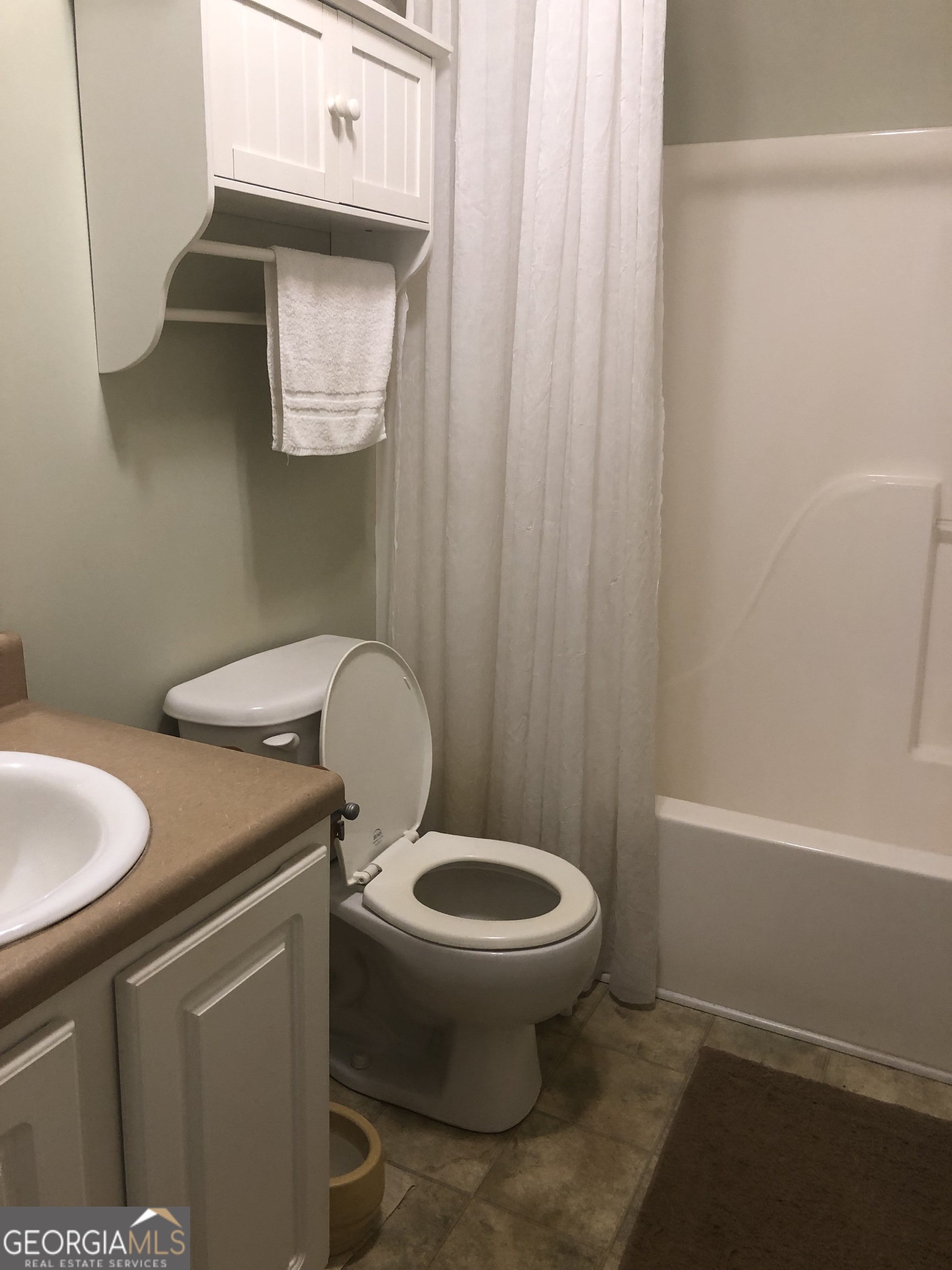 1744 Campbell Road Covington, GA 30014 - Photo 11 of 29 a bathroom with a sink and a toilet