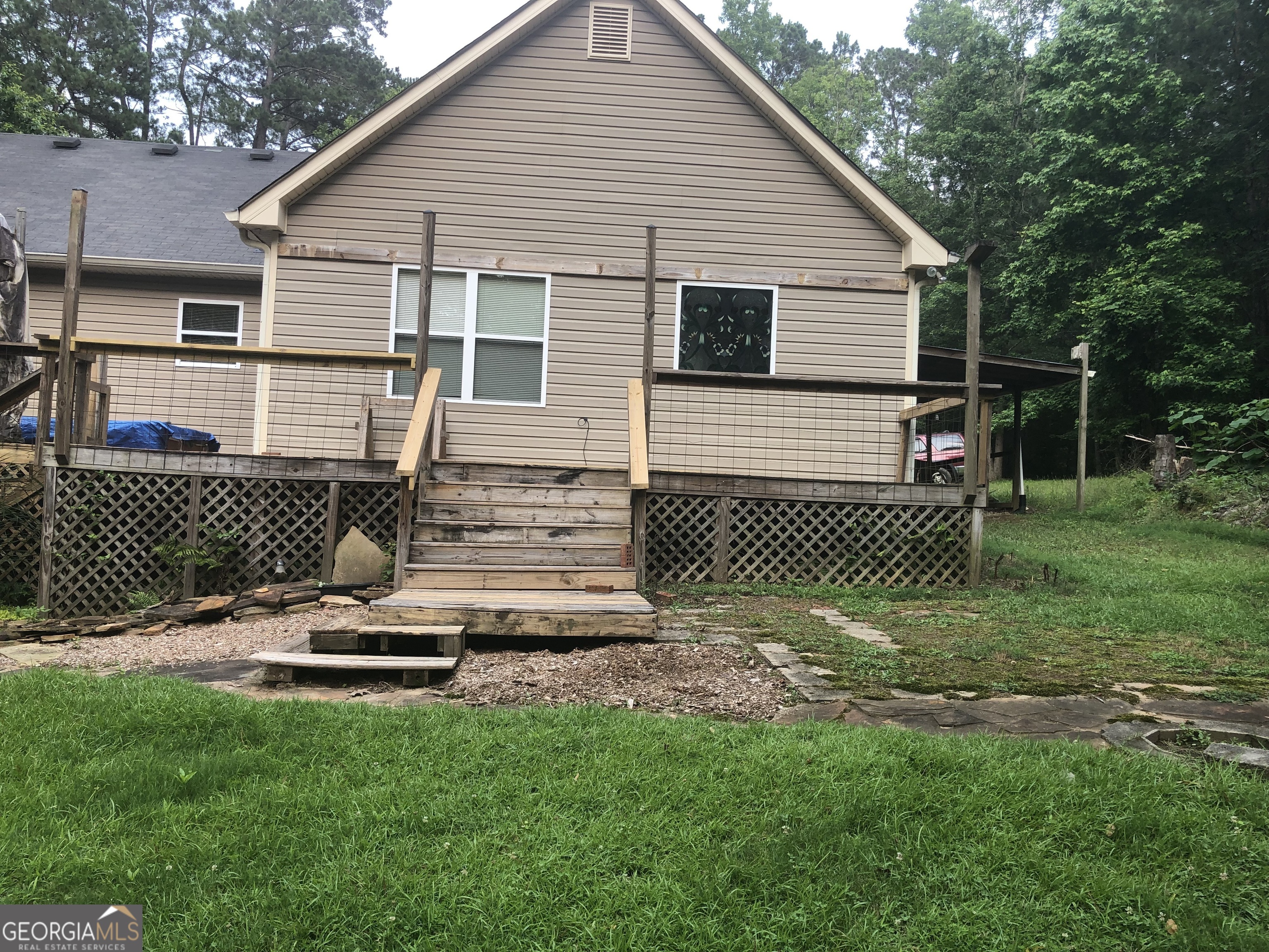 1744 Campbell Road Covington, GA 30014 - Photo 23 of 29 a front view of a house with a yard