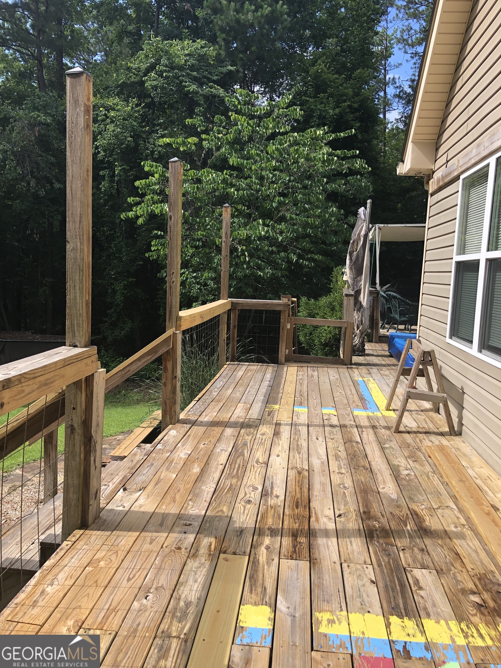 1744 Campbell Road Covington, GA 30014 - Photo 24 of 29 a view of balcony with wooden floor and fence