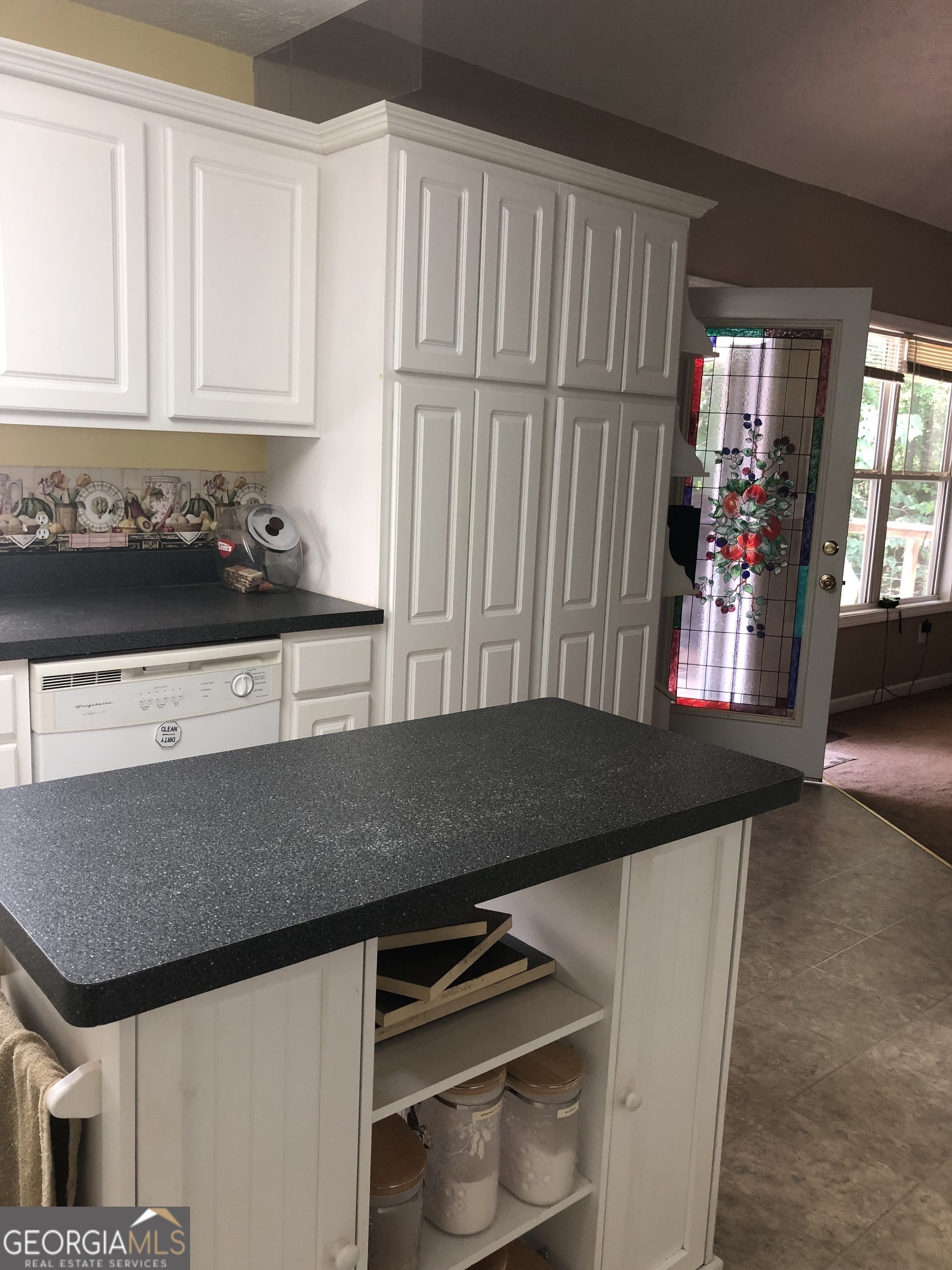 1744 Campbell Road Covington, GA 30014 - Photo 7 of 29 a kitchen with a sink and cabinets