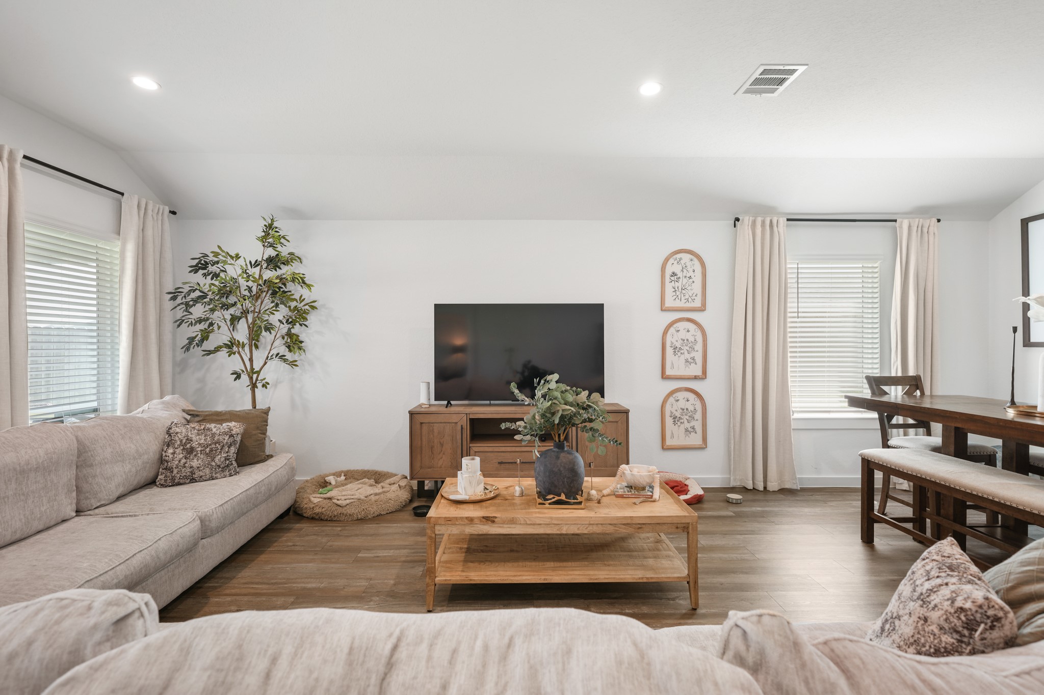 8918 Century Plant Lane Rosharon, TX 77583 - Photo 11 of 19 Spacious living area featuring neutral finishes, recessed lighting, wood-look flooring, and easy flow into the dining space.