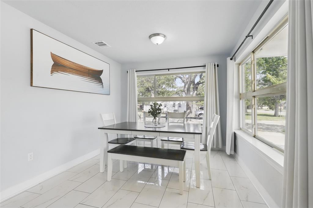 5200 Barbara Road River Oaks, TX 76114 - Photo 12 of 40 a dining room with a large window and bed