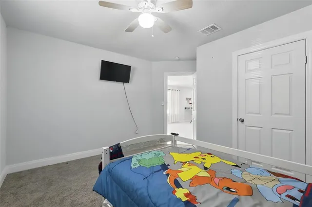 a bed room with a bed and a chandelier