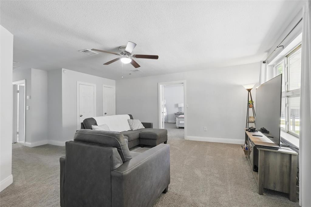 5200 Barbara Road River Oaks, TX 76114 - Photo 22 of 40 a living room with furniture and a flat screen tv