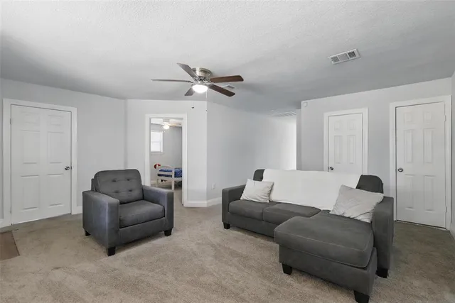 a spacious bedroom with a bed and a desk