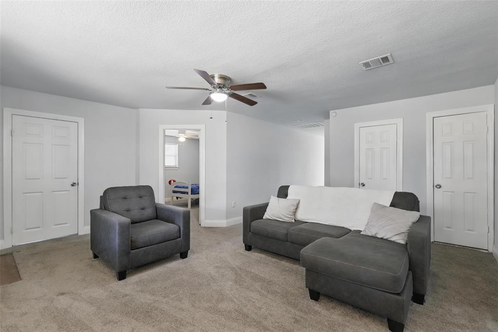 5200 Barbara Road River Oaks, TX 76114 - Photo 24 of 40 a living room with furniture and a ceiling fan
