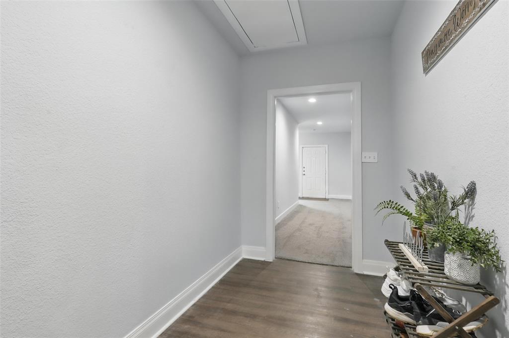 5200 Barbara Road River Oaks, TX 76114 - Photo 33 of 40 a view of a room with wooden floor and a potted plant