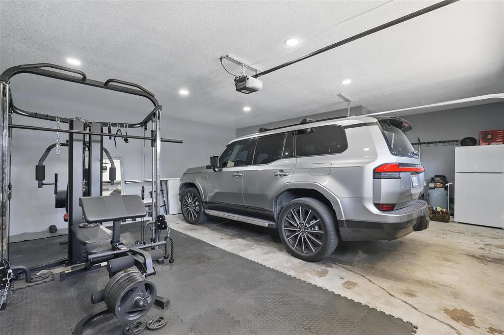 5200 Barbara Road River Oaks, TX 76114 - Photo 34 of 40 a car is parked in a garage