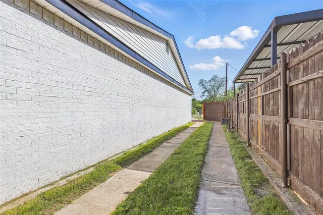 a view of a backyard with swimming pool