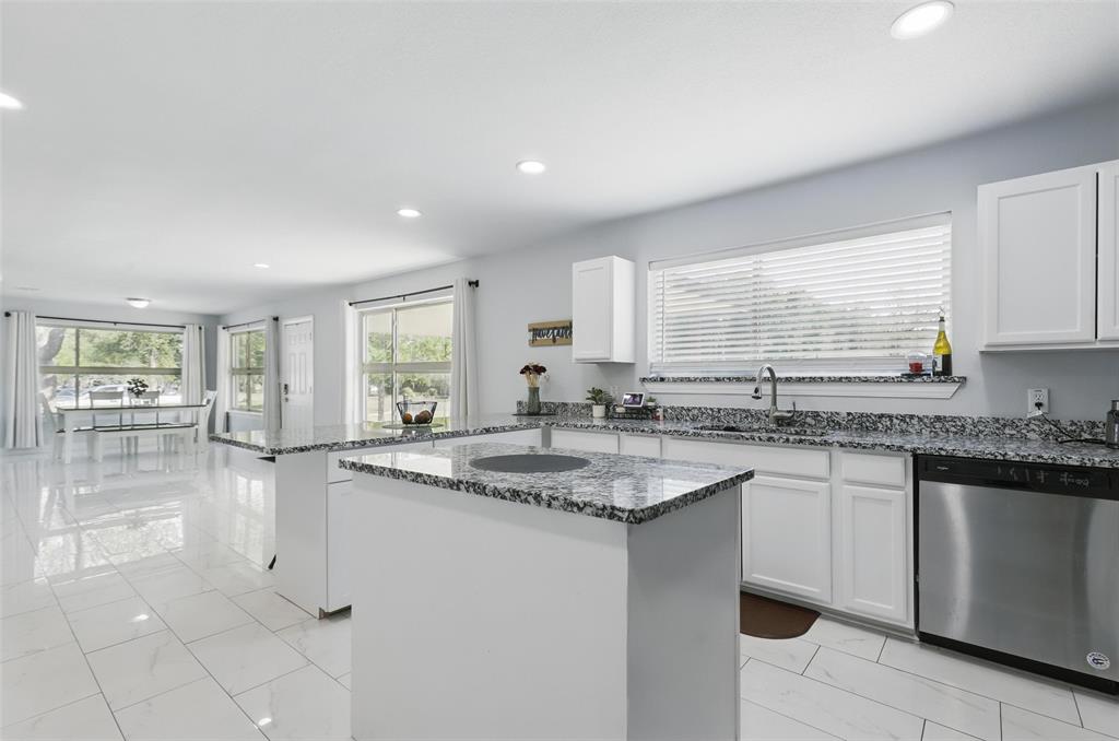 5200 Barbara Road River Oaks, TX 76114 - Photo 4 of 40 a kitchen with sink stove and cabinets