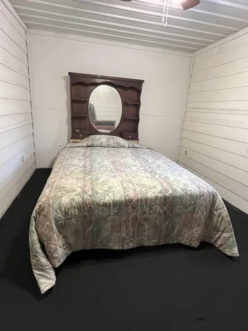 a kitchen with a cabinets and wooden floor