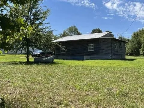 a view of a lake with a yard