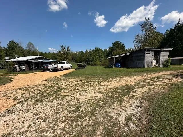 a view of a field with an trees