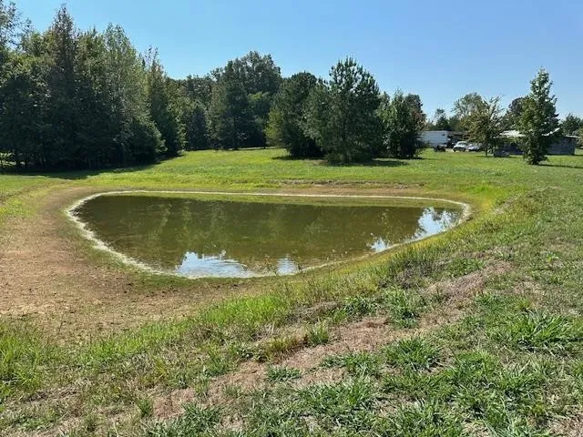 a view of a lake with a yard