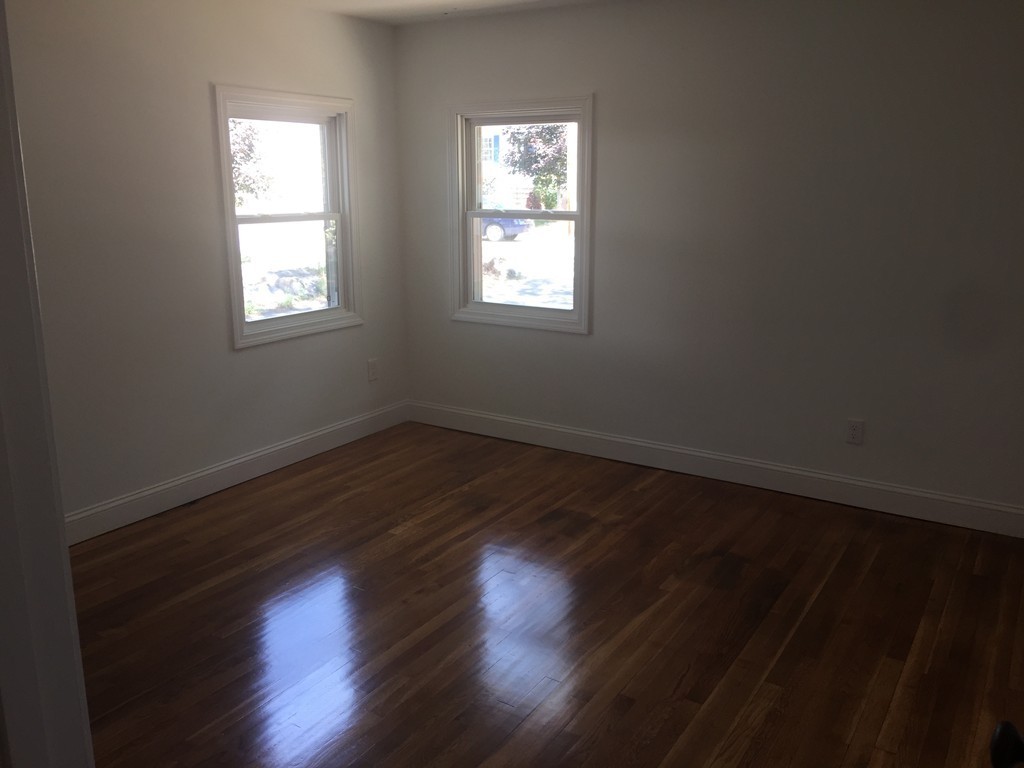 28 Bulfinch Terrace Lynn, MA 01902 - Photo 15 of 30 a view of wooden floor and windows in a room